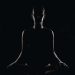 Woman practicing yoga silhouette illustrating hidden spiritual and physical dangers of yoga.