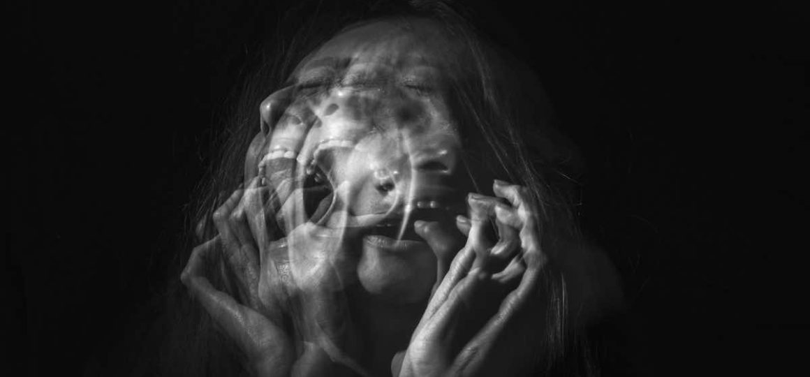 Screaming woman with a blurred face.
